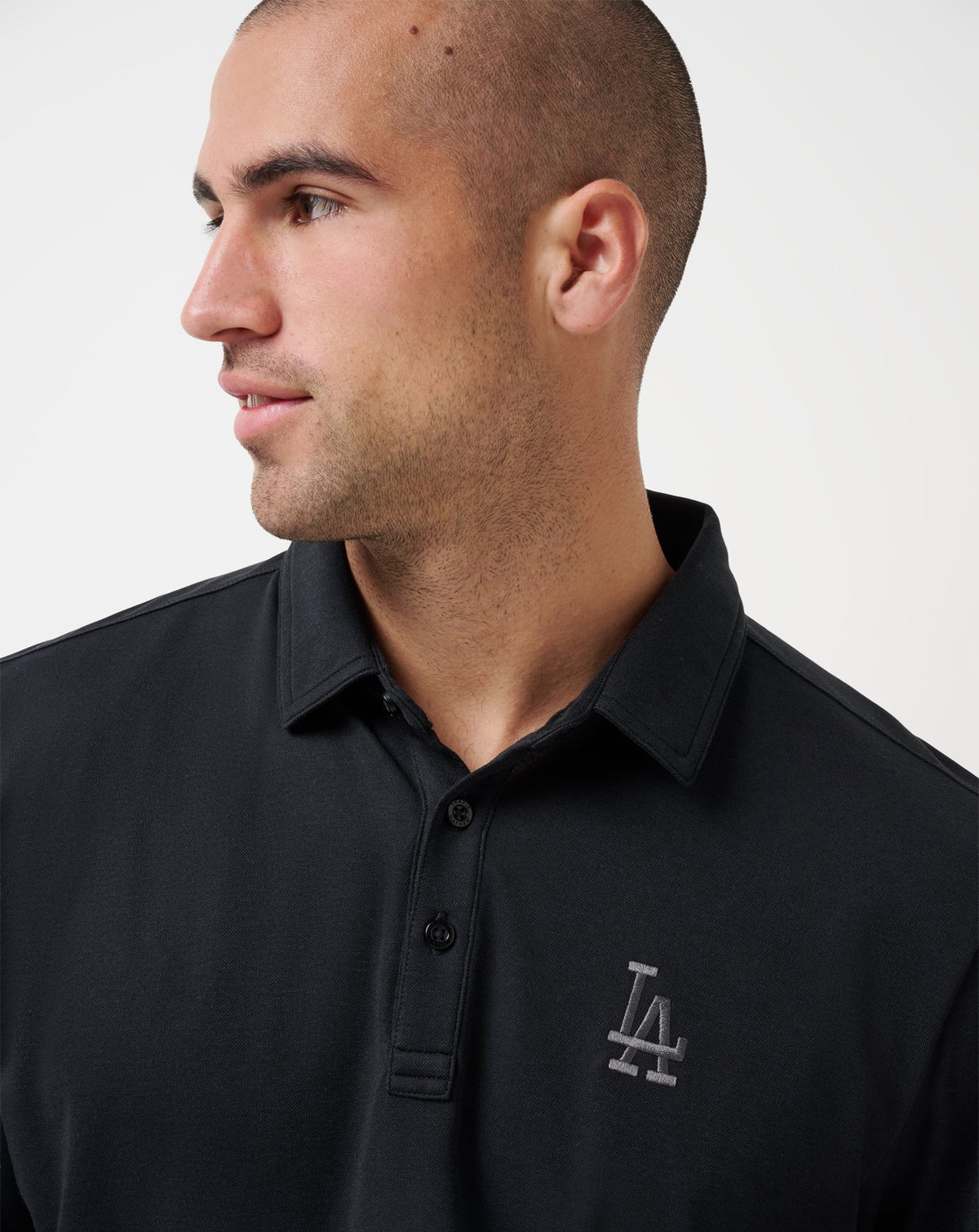 Los Angeles Dodgers Playoff Pitch Polo Black | Travis Mathew