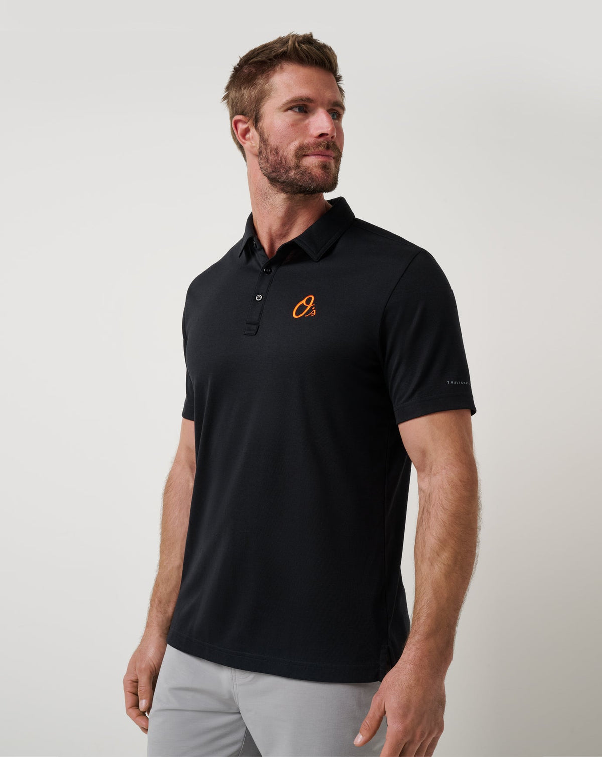 Baltimore Orioles Playoff Pitch Polo Black | Travis Mathew