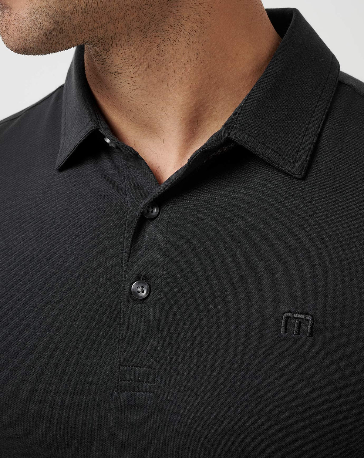 Featherweight Polo Black | Travis Mathew