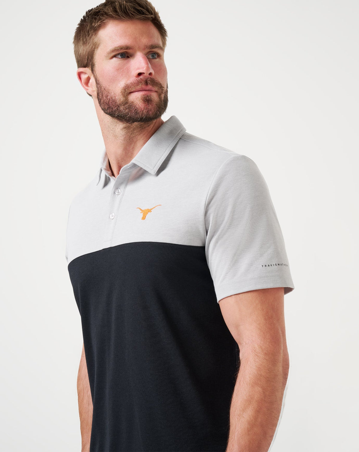UT Austin Drop Back Polo Heather Grey/Black | Travis Mathew