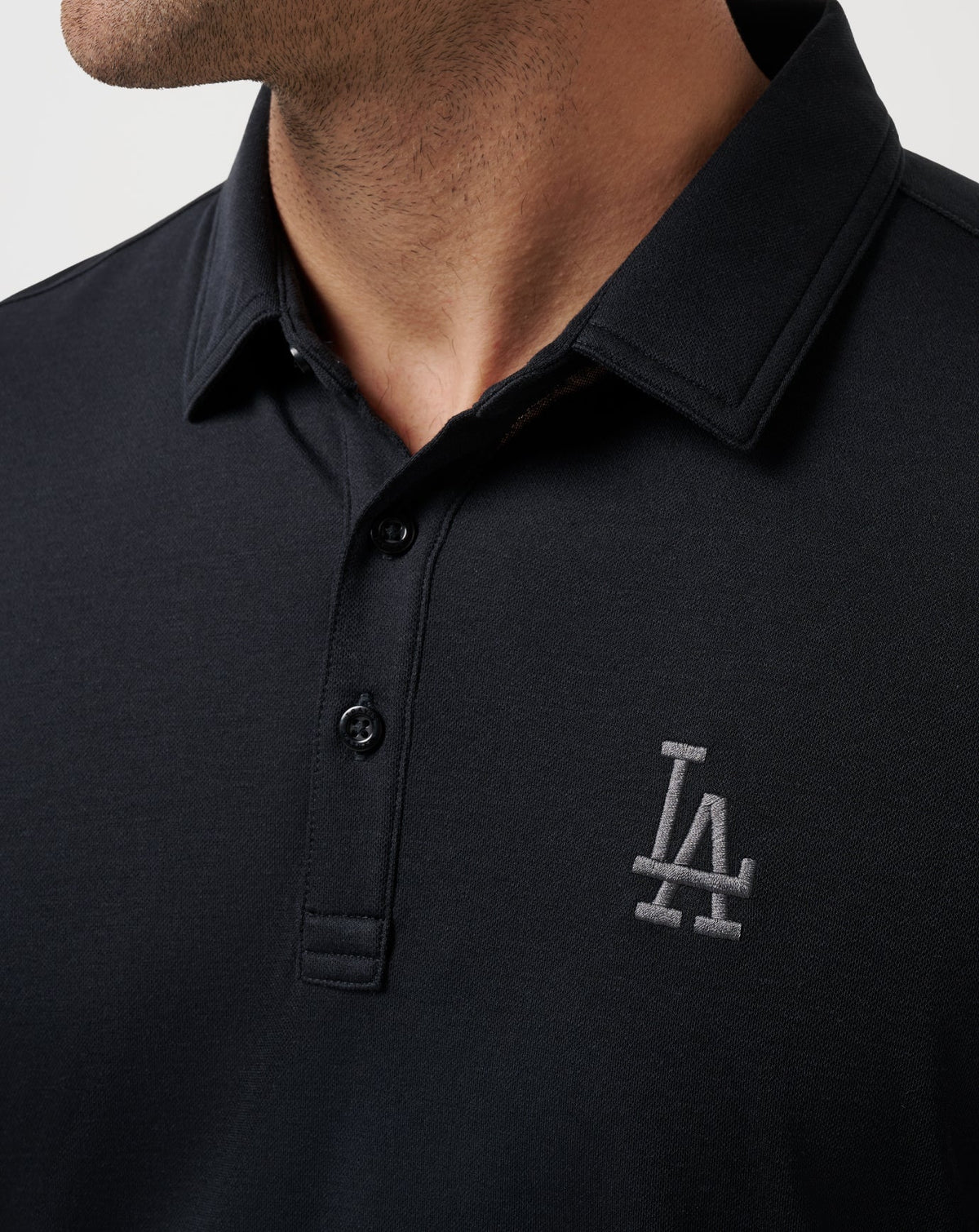 Los Angeles Dodgers Playoff Pitch Polo Black | Travis Mathew