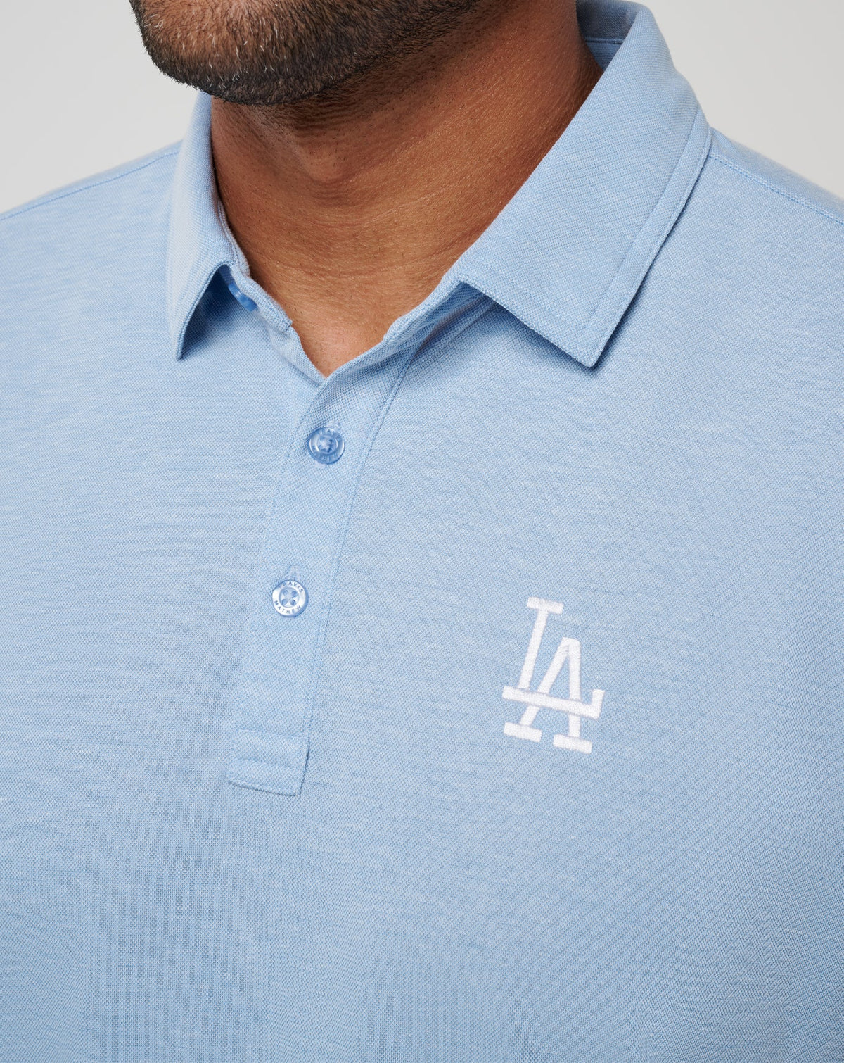 Los Angeles Dodgers Playoff Pitch Polo Heather Blue | Travis Mathew