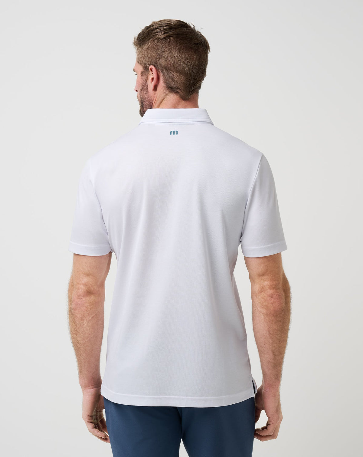 Overstay Polo White | Travis Mathew