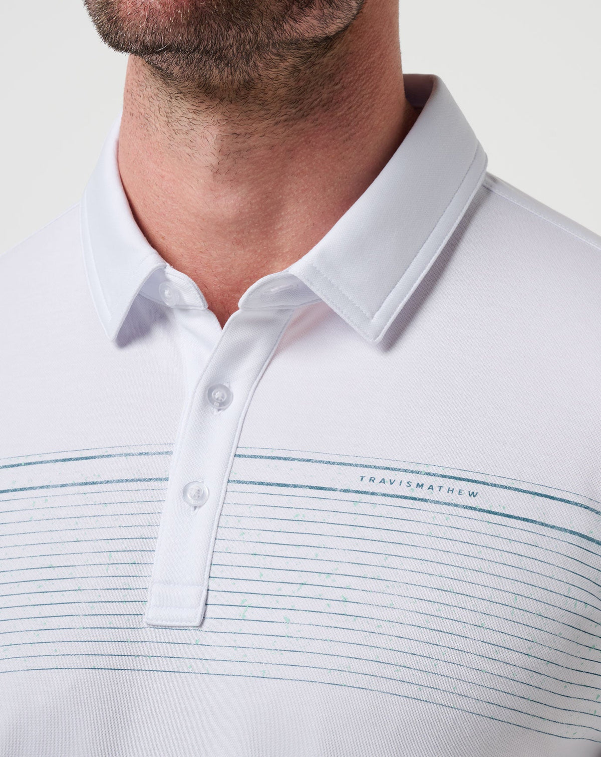 Overstay Polo White | Travis Mathew