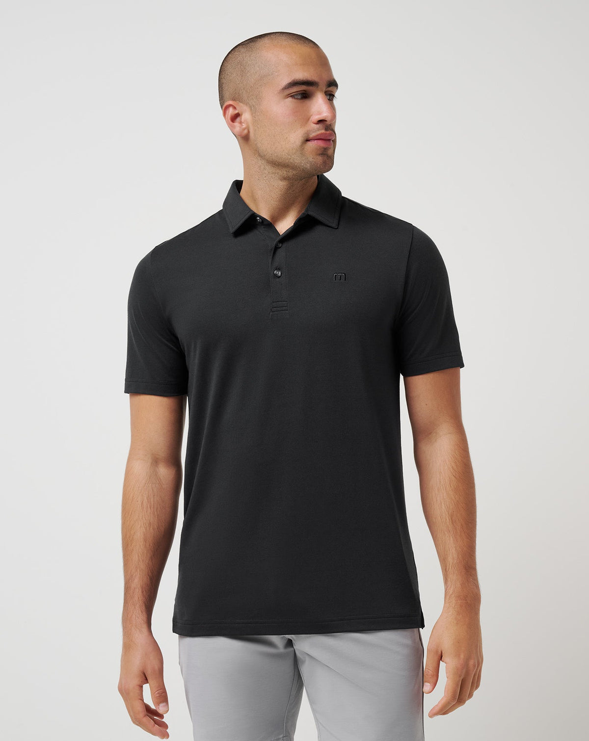 Featherweight Polo Black | Travis Mathew