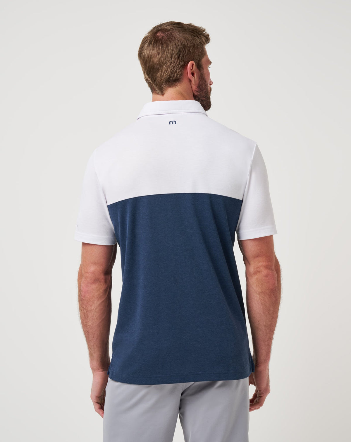Michigan Drop Back Polo White/Navy | Travis Mathew