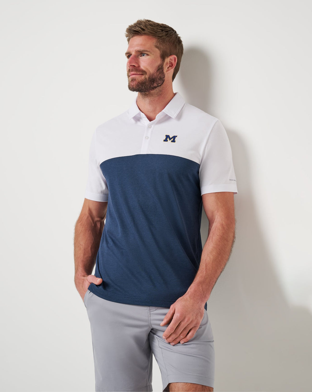 Michigan Drop Back Polo White/Navy | Travis Mathew