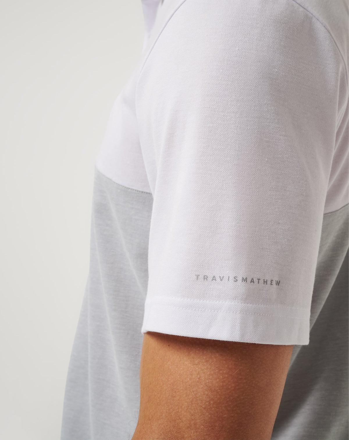 UCLA Drop Back Polo White/Heather Grey | Travis Mathew