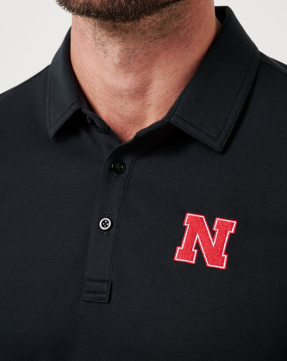 Nebraska School Pride Polo Black | Travis Mathew