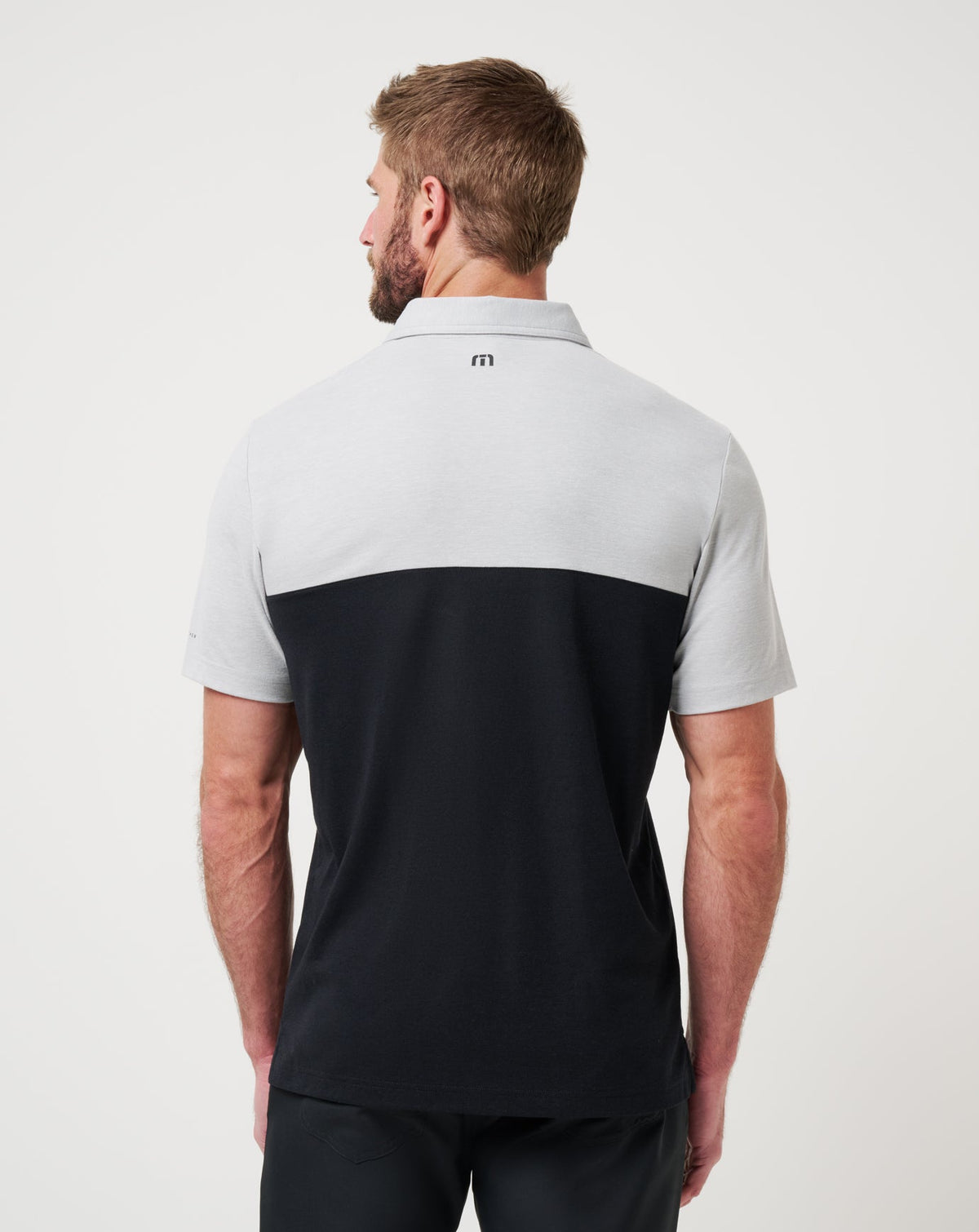 UT Austin Drop Back Polo Heather Grey/Black | Travis Mathew