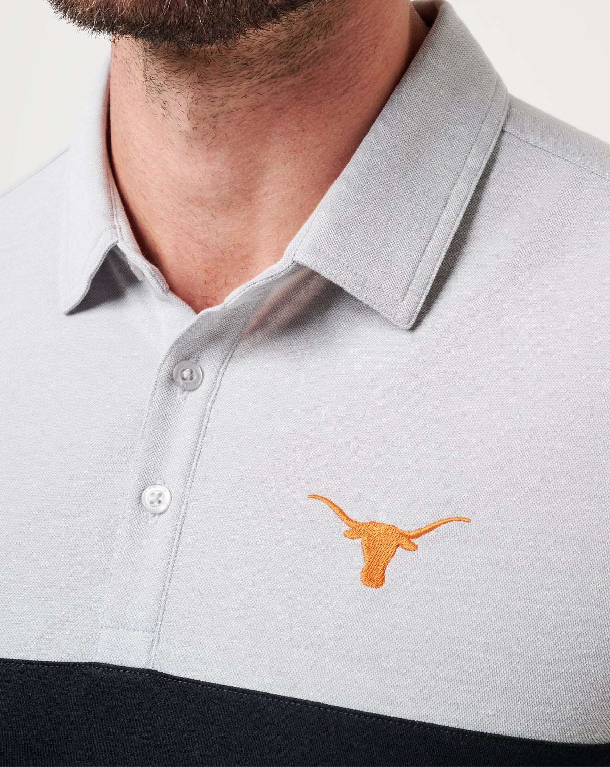 UT Austin Drop Back Polo Heather Grey/Black | Travis Mathew