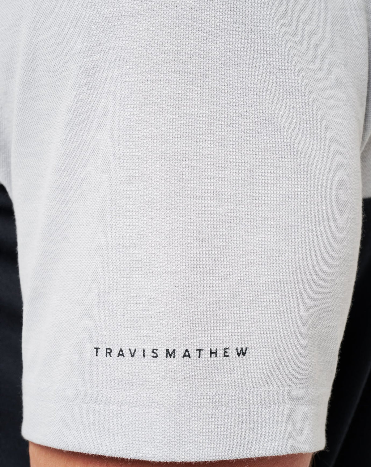 UT Austin Drop Back Polo Heather Grey/Black | Travis Mathew
