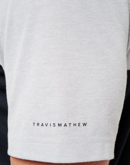 UT Austin Drop Back Polo Heather Grey/Black | Travis Mathew